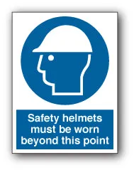 Safety helmets must be worn beyond this point