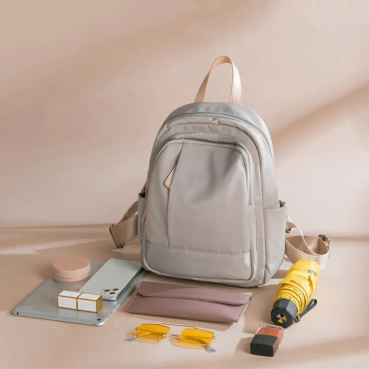 Sleek Minimalist Backpack in Elegant Light Gray – Smooth Finish with Practical Front Pocket and Adjustable Straps