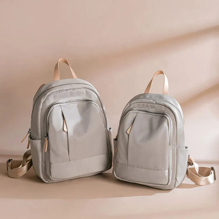 Sleek Minimalist Backpack in Elegant Light Gray – Smooth Finish with Practical Front Pocket and Adjustable Straps