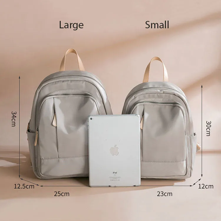 Sleek Minimalist Backpack in Elegant Light Gray – Smooth Finish with Practical Front Pocket and Adjustable Straps