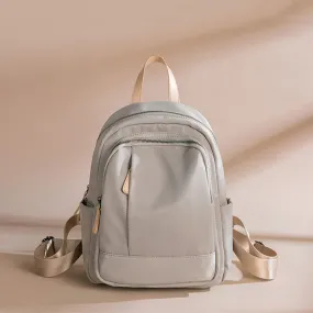 Sleek Minimalist Backpack in Elegant Light Gray – Smooth Finish with Practical Front Pocket and Adjustable Straps